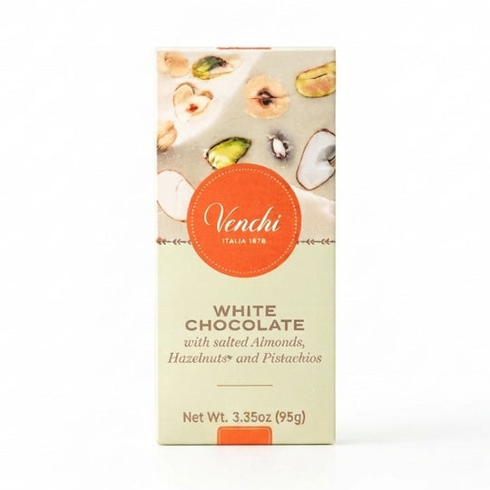 Venchi vit chokladförpackning med orange logga och bild på smält choklad