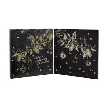 Chokladshopen Anthon Berg likörkalender med 24 luckor och elegant julmotiv i svart och guld.