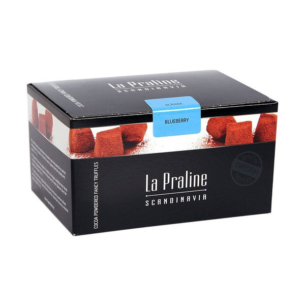 Chokladshopen La Praline blåbärstryfflar i en elegant svart presentask med pudrade chokladtryfflar.