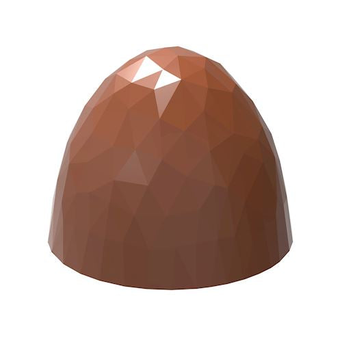 Isolerad brun facetterad bullet-pralin